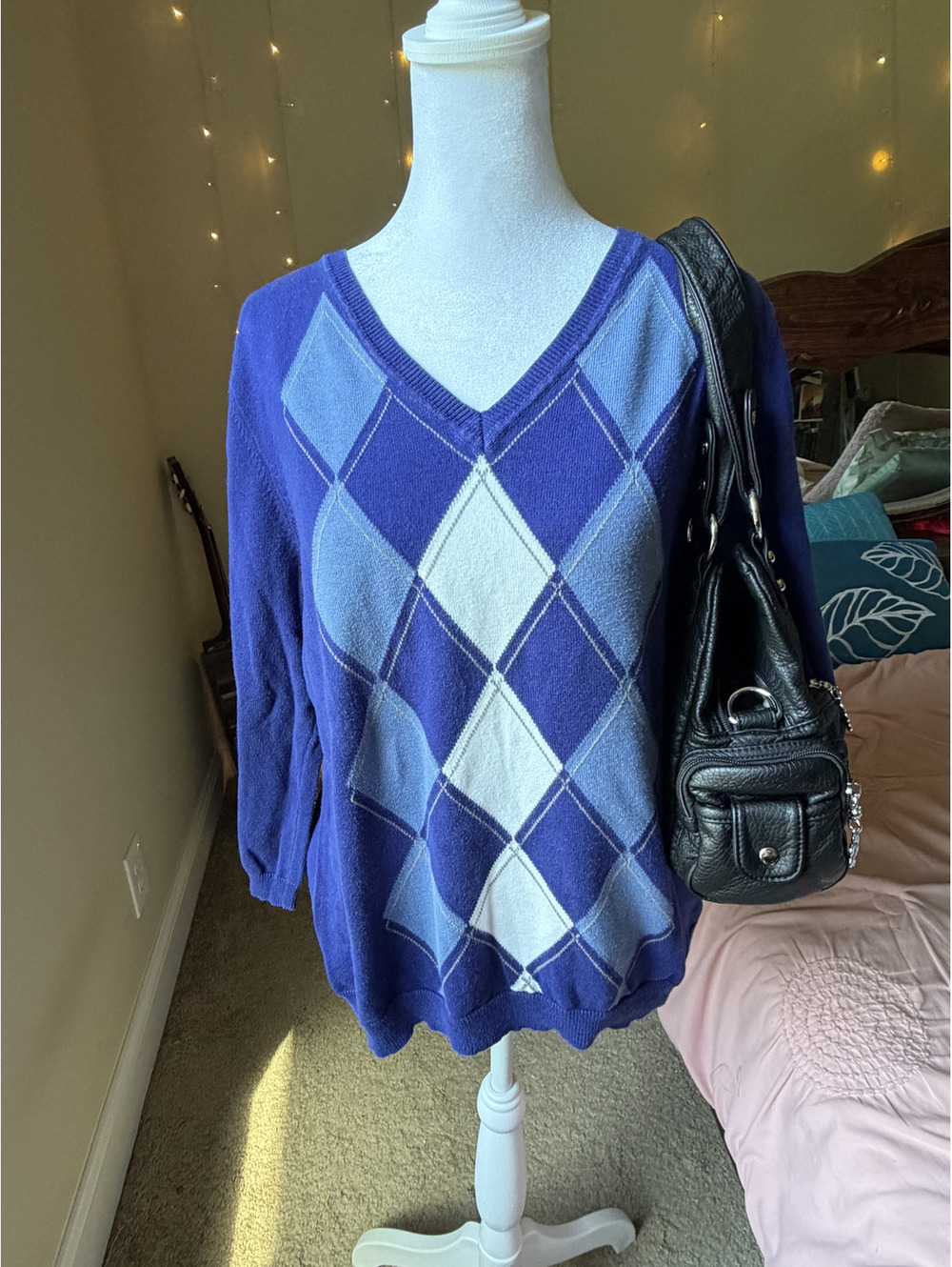 Knit sweater with a royal blue base with an oversized argyle diamond pattern